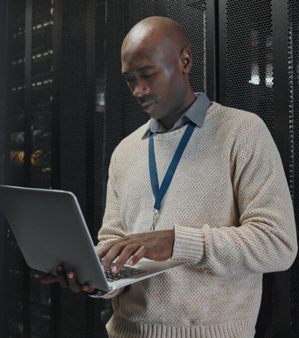 Laptop,,Server,Room,And,Black,Man,Or,Technician,In,Data