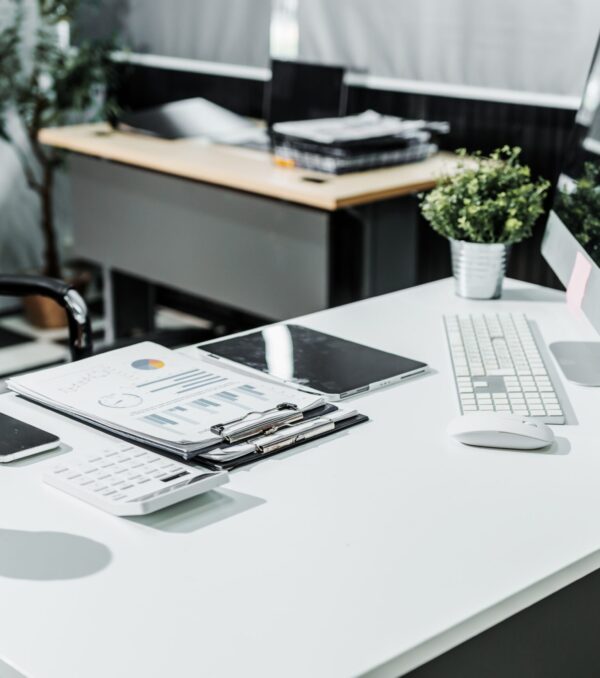 A,Modern,,White-colored,Business,Office,With,A,Wooden,Desk,,Calculator,